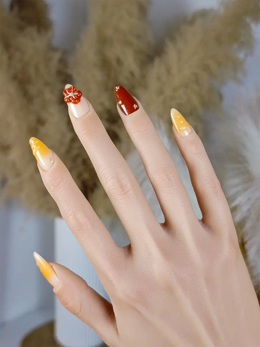 Handcrafted Almond Press Ons with Red-Orange Floral Art and Golden Pearl Details