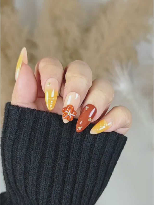 Handcrafted Almond Press Ons with Red-Orange Floral Art and Golden Pearl Details